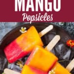 strawberry and mango popsicles in a tray with ice cubes with text overlay.