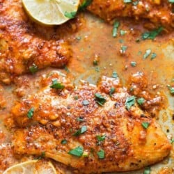 marinated baked tilapia on baking tray