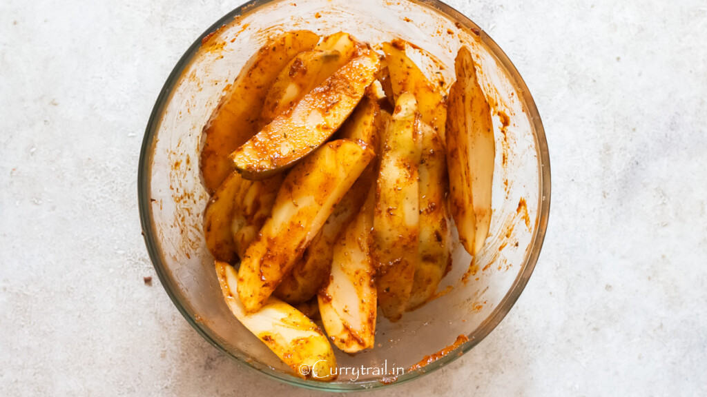 potatoes seasoned in spice mix.