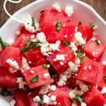 watermelon feta salad in white bowl with text