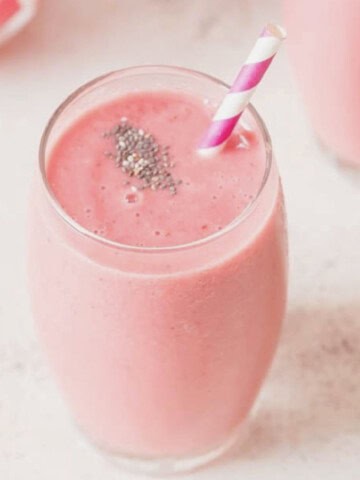 watermelon smoothie with chia seeds sprinkled on top.