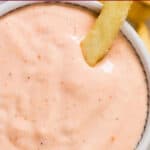 appetizer sauce in small bowl with fries with text