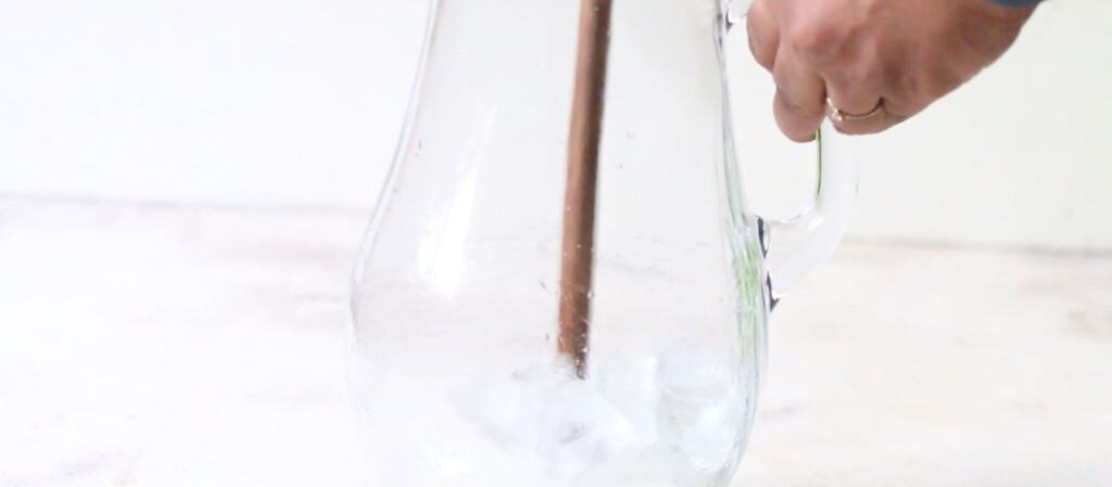 stir powdered sugar, mint leaves and ice in a pitcher.