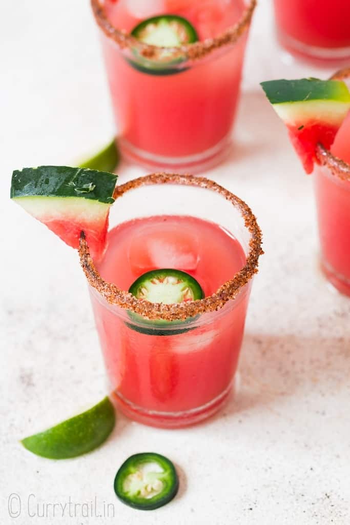 spicy watermelon margarita recipe served with jalapeno slices and watermelon slice