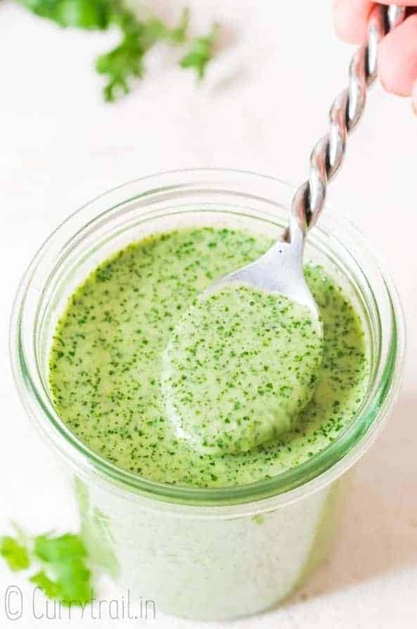 a jar of cilantro sauce with spoon and text overlay