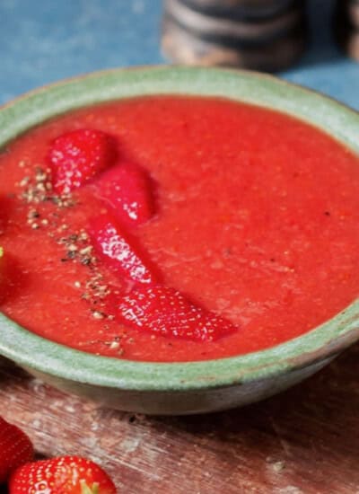 a bowl of chilled gazpacho made of strawberries.