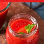 strawberry gazpacho in a glass with text.