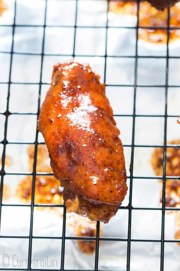 a single piece of instant pot chicken wing on baking tray