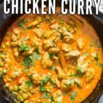 chicken curry in cast iron pan with text overlay