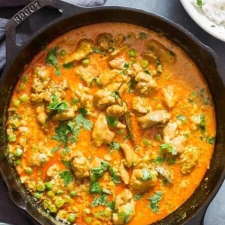 chicken curry in cast iron pan