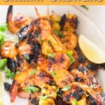 pineapple and shrimp skewers with teriyaki sauce with text.