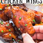 most succulent chicken wings cooked in instant pot served with sour cream on plate with text