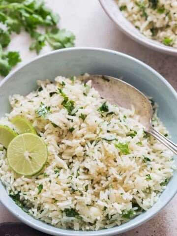 bowl of cilantro and lime rice with spoon