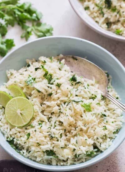 bowl of cilantro and lime rice with spoon