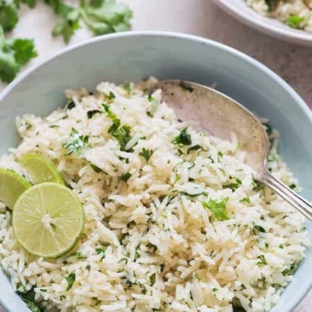 bowl of cilantro and lime rice with spoon