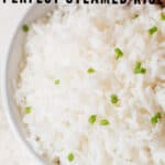 perfectly cooked steamed rice in ceramic bowl with text
