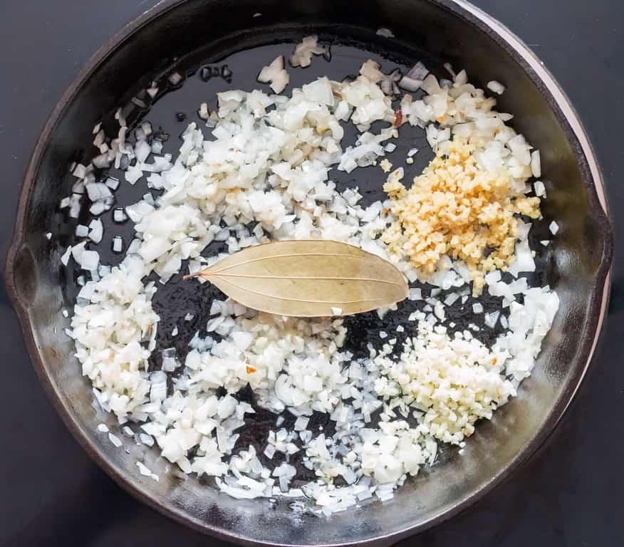 cooking ginger and garlic in cast iron pan