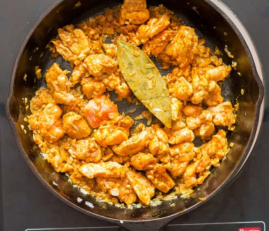 curry powder coconut chicken curry cooked in cast iron pan