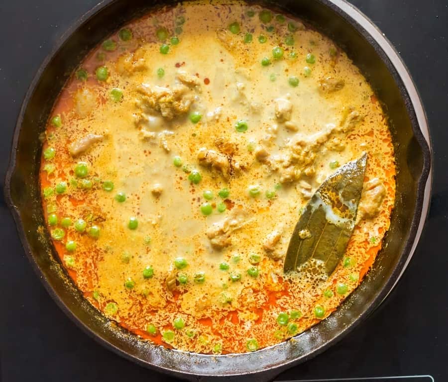 coconut curry chicken in cast iron pan