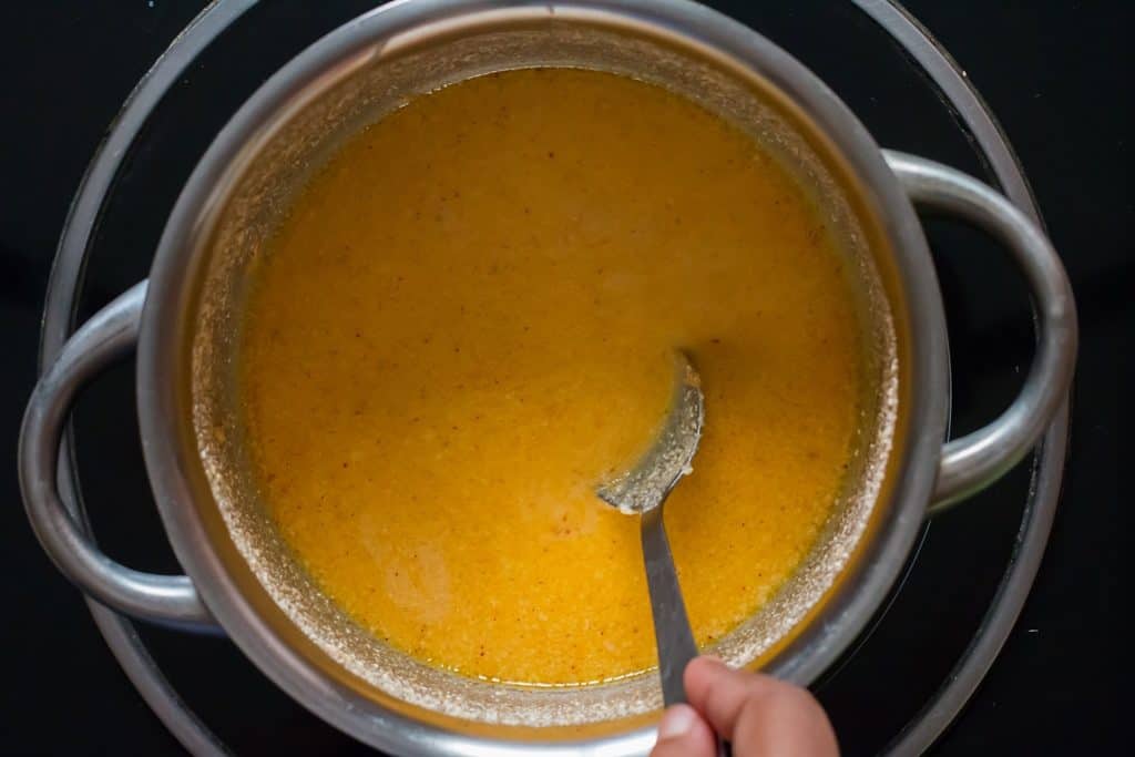 cooking beer cheese sauce in sauce pan
