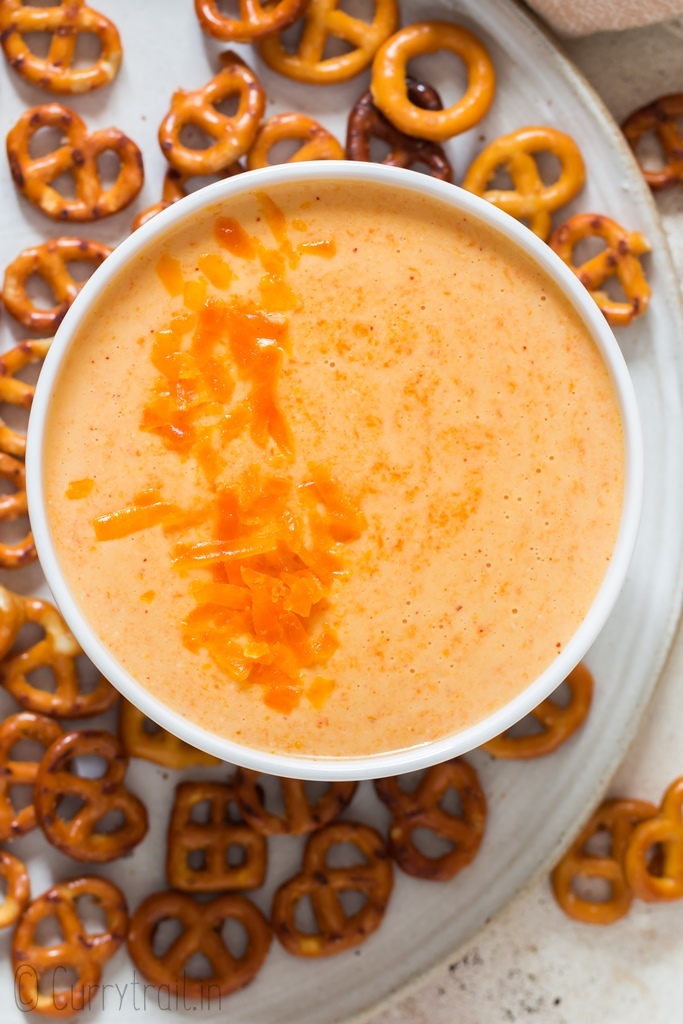 beer cheese sauce served in small white bowl