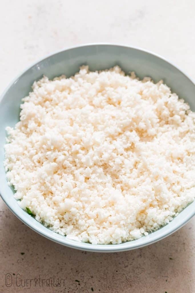 cauliflower rice served in blue ceramic bowl