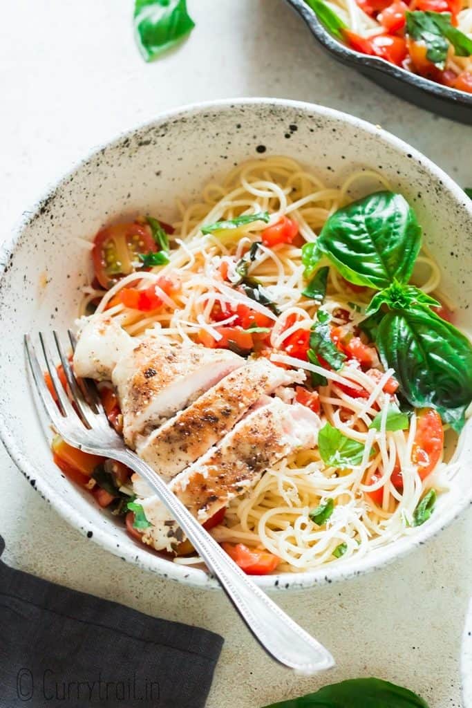 bruschetta chicken pasta salad served in white bowls