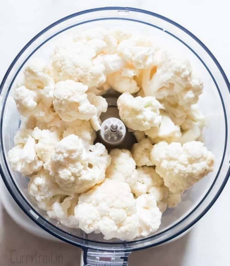 cauliflower florets placed in food processor to make cauliflower rice