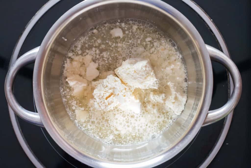 cream cheese and beer added to sauce pan
