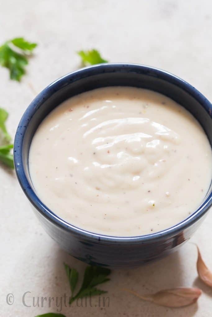 Cheesy garlic sauce in bowl