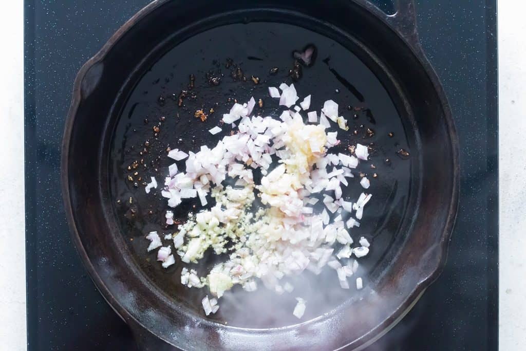 garlic onions sauted in cast iron pan