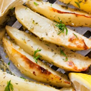 healthy overn roasted Greek lemon potatoes on baking sheet