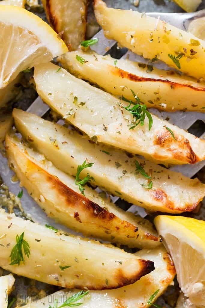 healthy overn roasted Greek lemon potatoes on baking sheet