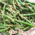 green beans sauteed with lemon garlic Parmesan on white plate with text