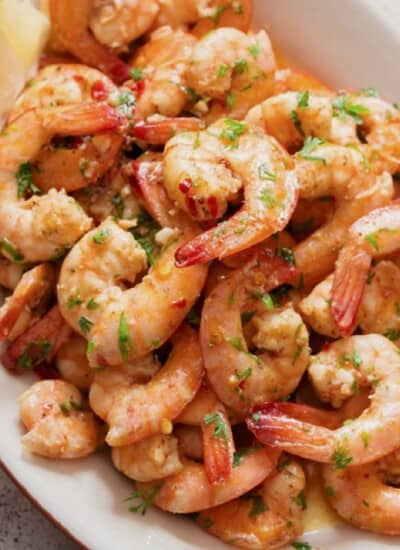 close view of lemon garlic shrimp on a plate.