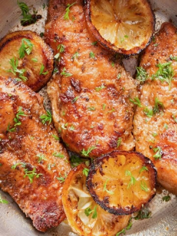 3 lemon pepper chicken breasts in a skillet.