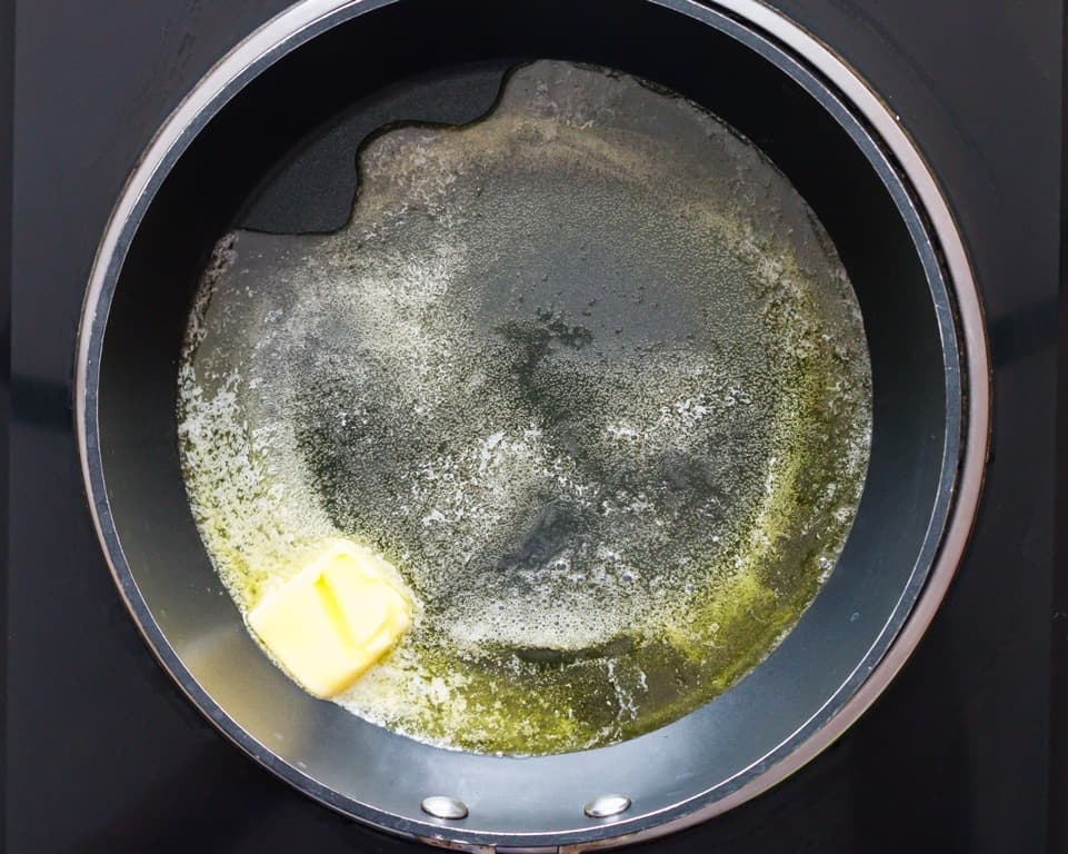 melting butter and olive oil in a skillet.