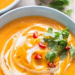 two bowls of curried pumpkin soup