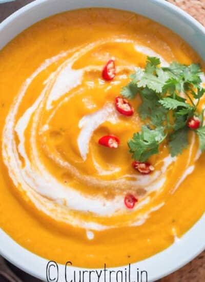 Thai vegan pumpkin curry soup with crusty bread on side