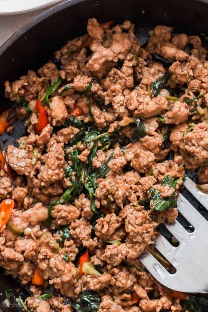 spicy thai basil chicken in pan