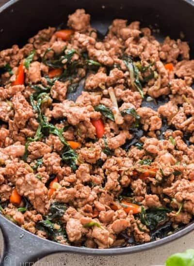 spicy Thai basil chicken in cast iron pan