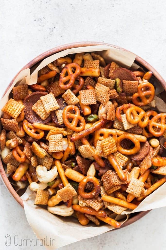 sweet and spicy chex mix in wooden bowl