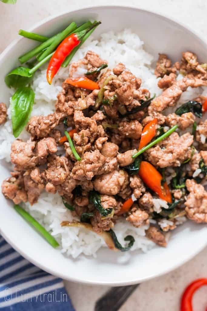 spicy Thai basil chicken over a bowl of rice