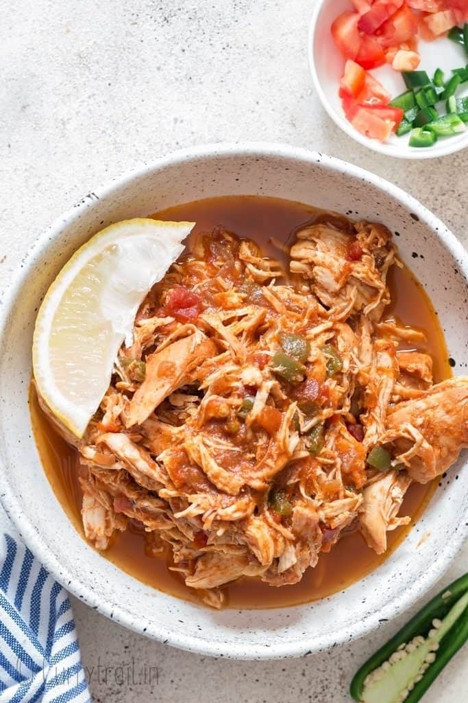 Mexican style instant pot shredded chicken in ceramic bowl