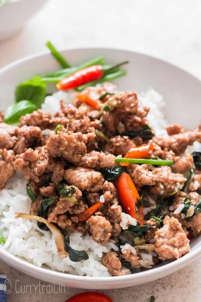 spicy Thai basil chicken over a bowl of rice