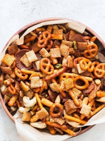 sweet and spicy chex mix in wooden bowl