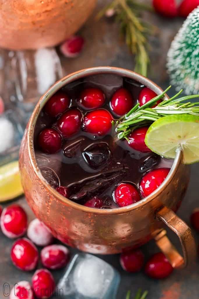 cranberry Moscow mule served in copper cups with ice, cranberries and lime