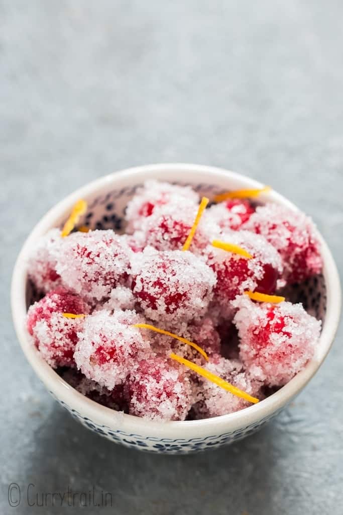 sugared cranberries in white bowl