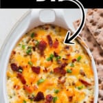 hot cheesy dip with crackers on the side with text overlay.