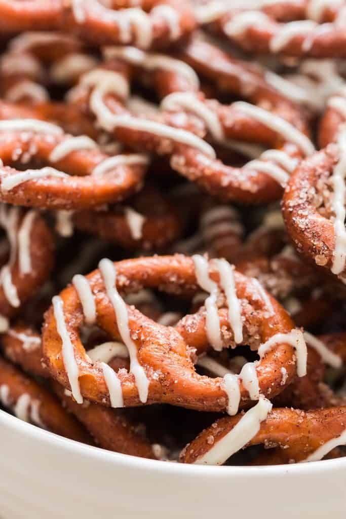 close view of cinnamon sugar coated pretzels with white chocolate drizzle